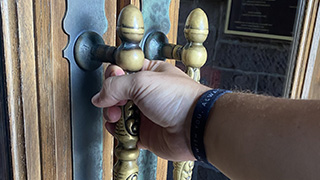 hand opening door A photo of someone opening a door