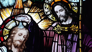 Baptism Stained glass window of the baptism in the seminary chapel
