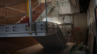 Renovation progress of the interior staircase that leads to the upper floors of Walsh Library.  Innovation Hub staircase