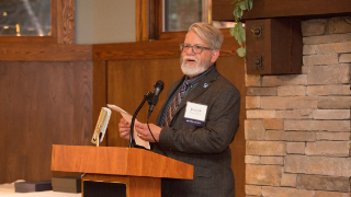 CEHS Interim Dean, Joseph Martinelli, Ed.D., addressing the audience of alumni, students, staff and friends of the college. 