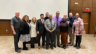 Officer Morrison and a group gather at Student Services' February Divisional Professional Development meeting. 