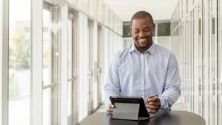 A man holding a tablet