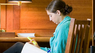 A girl reading a book.