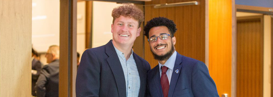 Image of two students shaking hands at the 2022 fall Career Fair. 