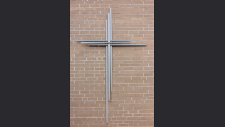 cross-on-wall A photo of a cross on a wall