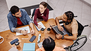 Diverse group of students studying together
