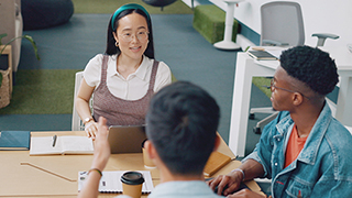 Diverse students working at a table