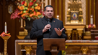 Father Dominic Ciriaco speaking in the University Chapel.