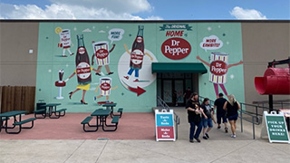 The front of Dr Pepper Museum, decorated in Dr. Pepper graphics