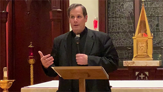 Father Douglas Milewski speaking on St. Augustine