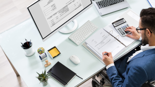 Image a professional working at a computer