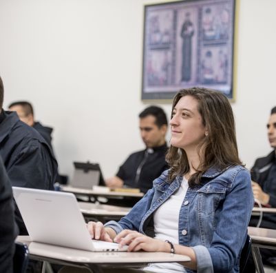 A female SHU MA Pastoral Ministry student in class