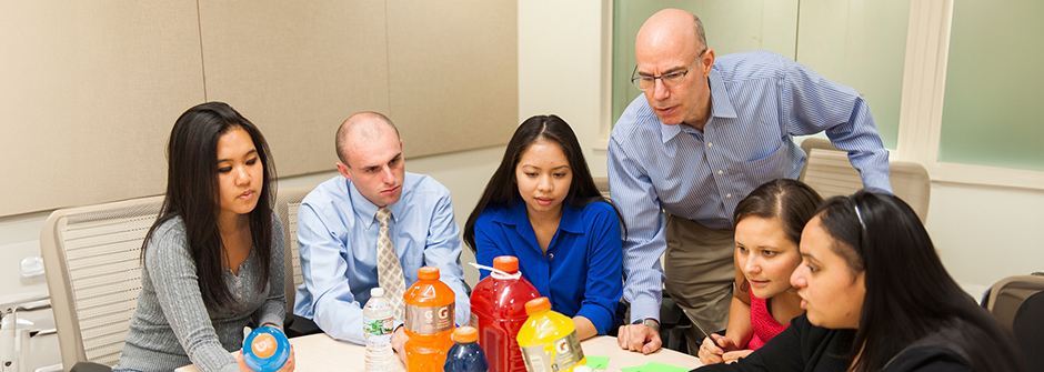 Market research participants looking at samples of sports drinks. 