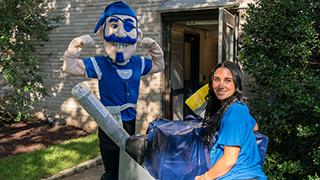 A Resident Assistant with the Seton Hall pirate on move-in day