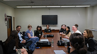 People from Seton Hall and Paramus Catholic in a meeting