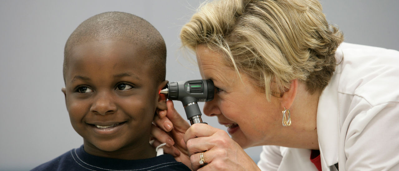 Child being checked by a pediatrician. 