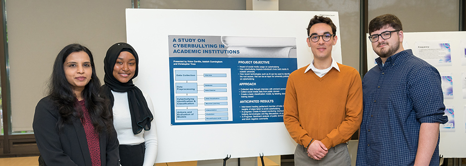 Petersheim presenters posing with their poster. 
