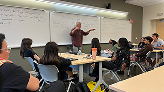 professor presenting to students on peace 