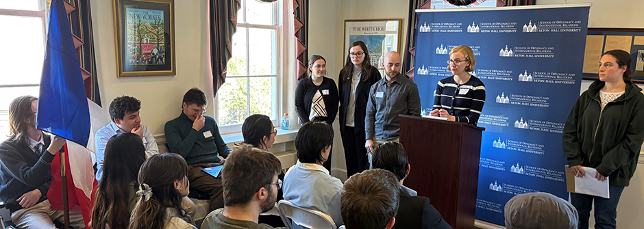 Image of students and faculty at a Serviam Institute event.