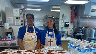 student volunteers making a mean at st francis inn