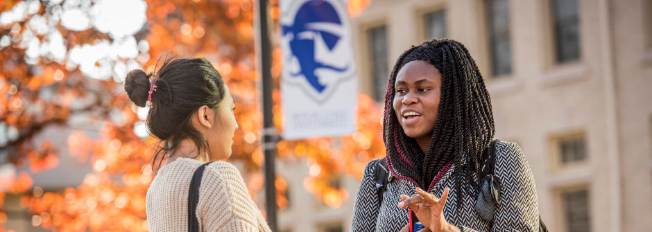 Students speaking outside. 