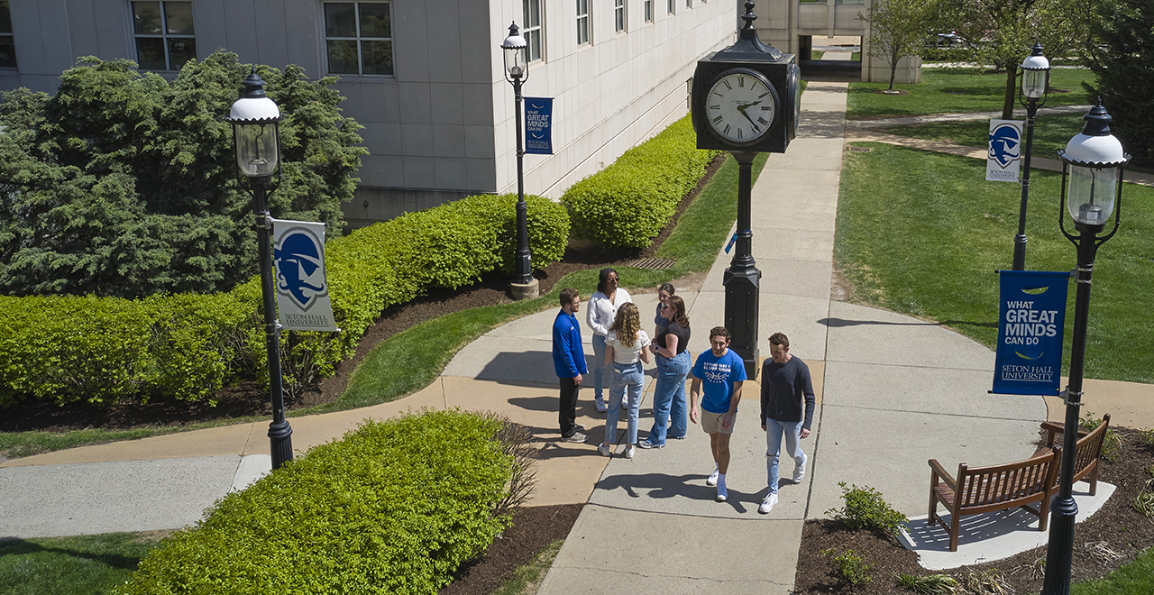 A photo of students standing on the University Green on the Seton Hall campus.