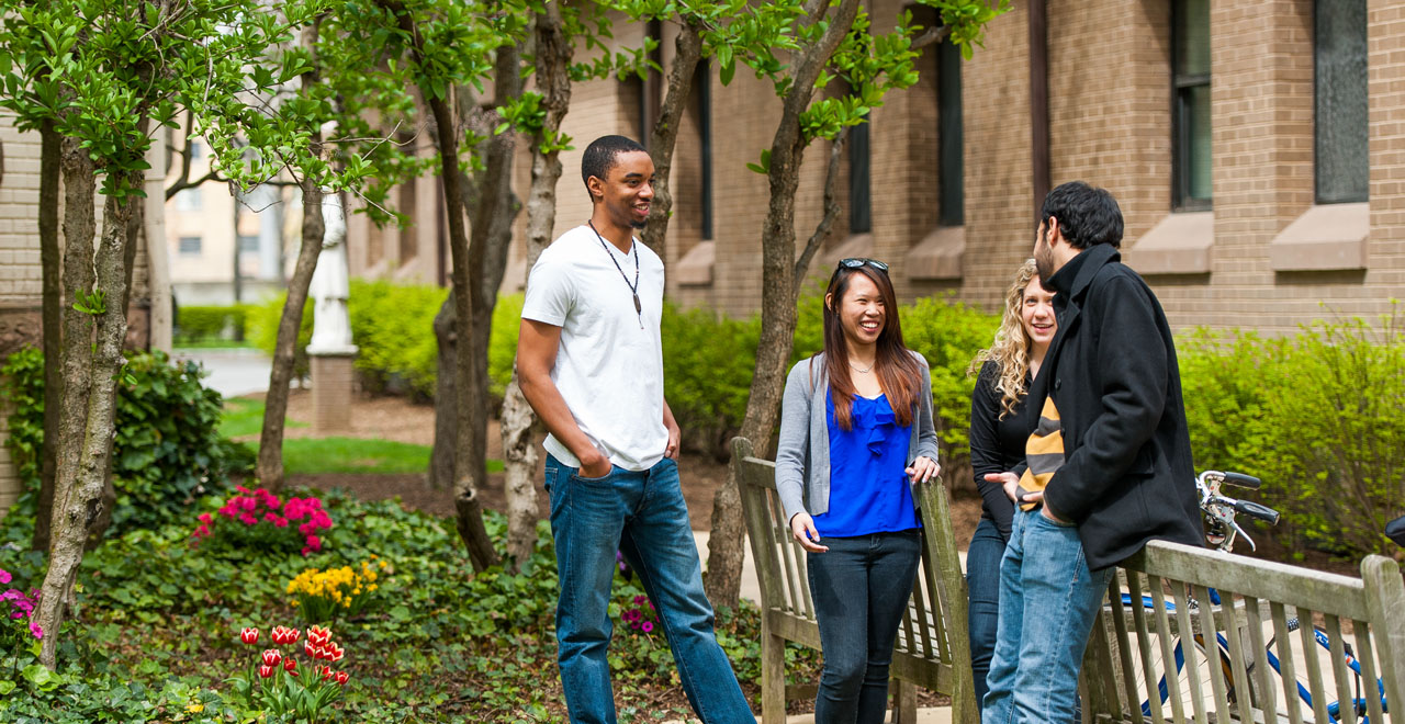 A photo of students standing on the University Green on the Seton Hall campus.