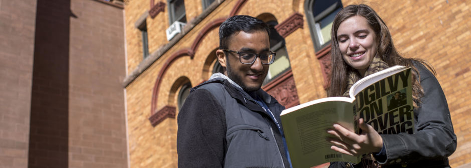 students reading outside