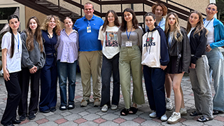 Group photo of Ukrainian students and professor