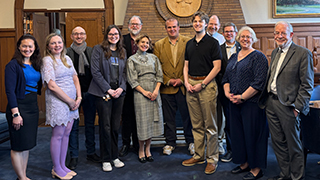 Seton Hall faculty and staff pose for a photo with Halyna Protsyk